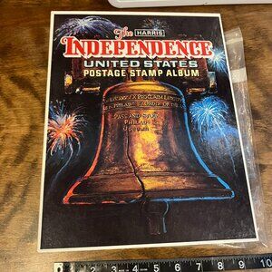 The Harris independence United States postage stamp album with several stamps !